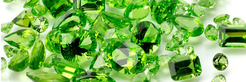 close up of faceted green peridot August Birthstone stones
