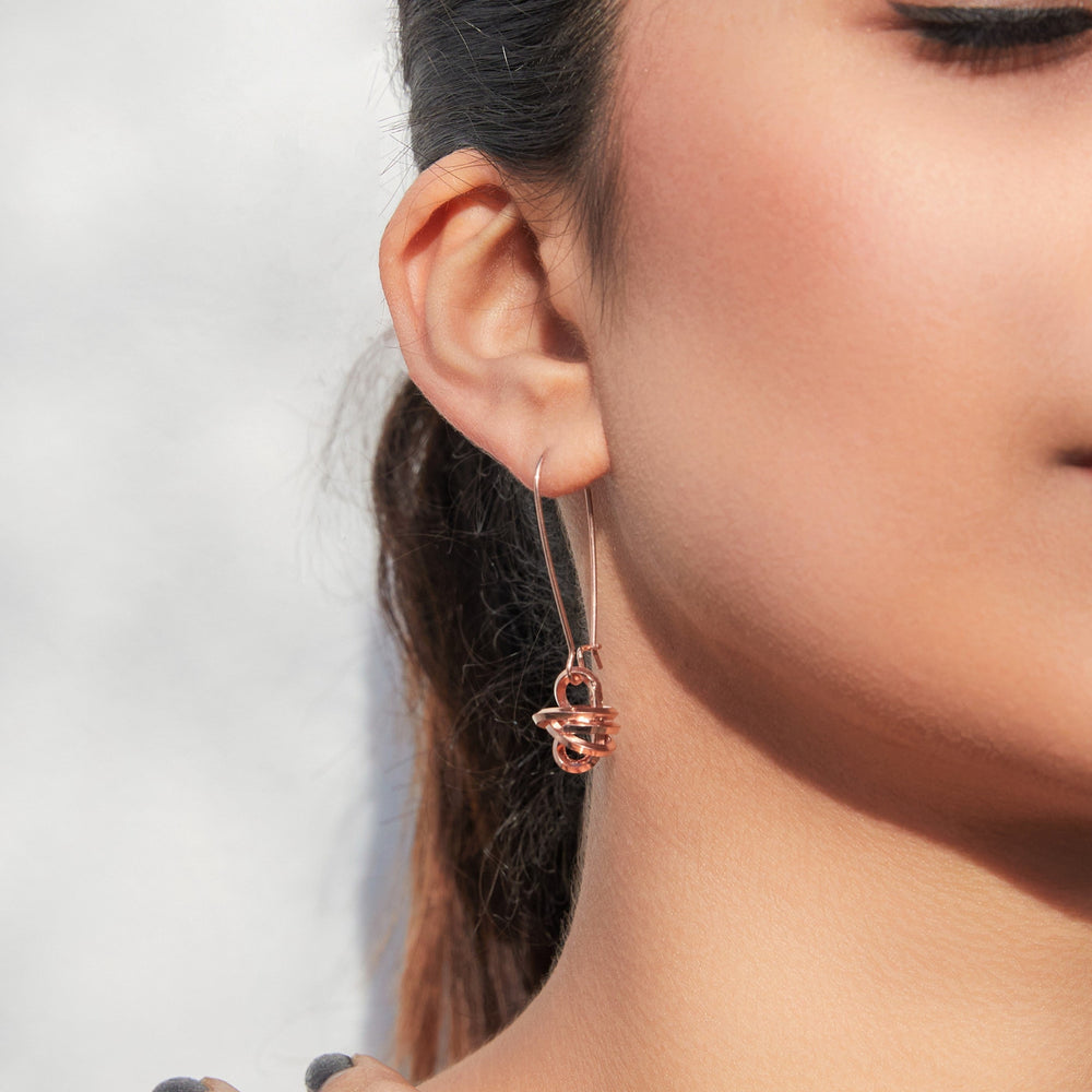 
            
                Load image into Gallery viewer, Long Knot Charm Rose Gold Drop Earrings
            
        