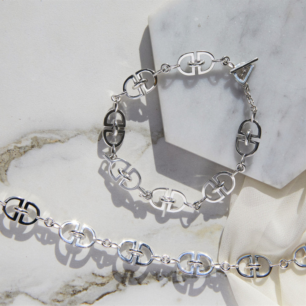 
            
                Load image into Gallery viewer, Interlinked &amp;#39;D&amp;#39; Charm Chunky Silver Bracelet
            
        