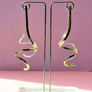 Gold and silver mixed metal spiral ear jackets.