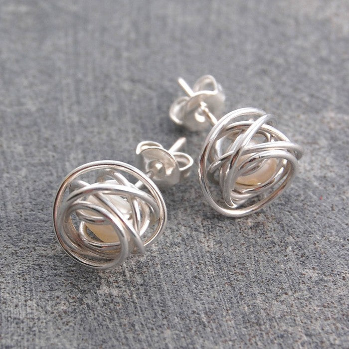 
            
                Load image into Gallery viewer, White Caged Pearl Stud Earrings - Otis Jaxon Silver Jewellery
            
        